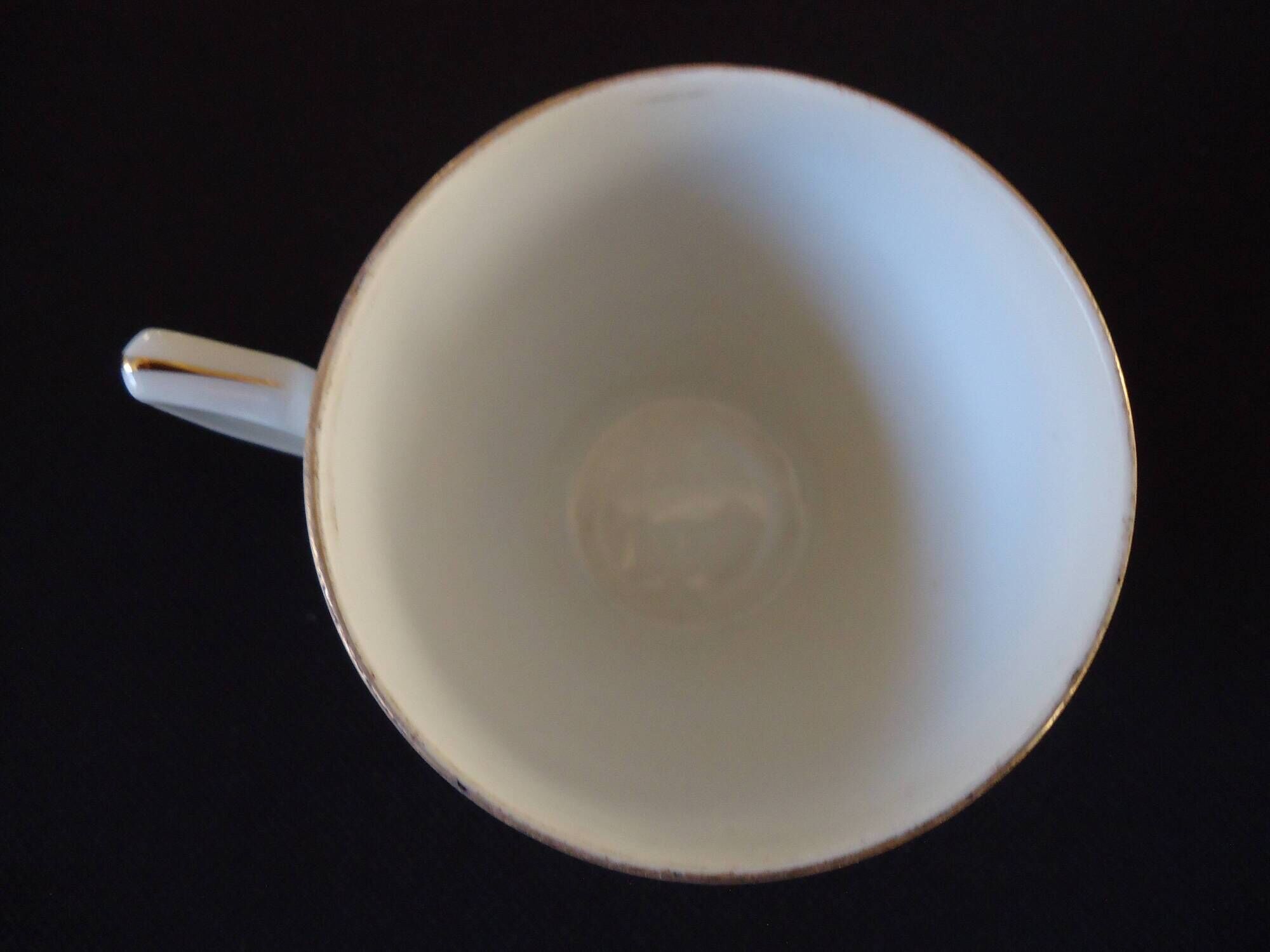 Set of six Art Deco white fine porcelain coffee cups and saucers