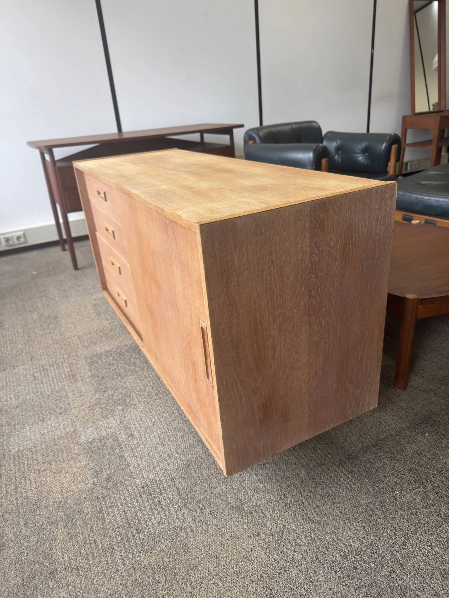 Danish buffet in light oak with sliding door and four drawers.