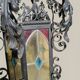 Black wrought iron lantern with stained glass. Medieval, Gothic decoration.