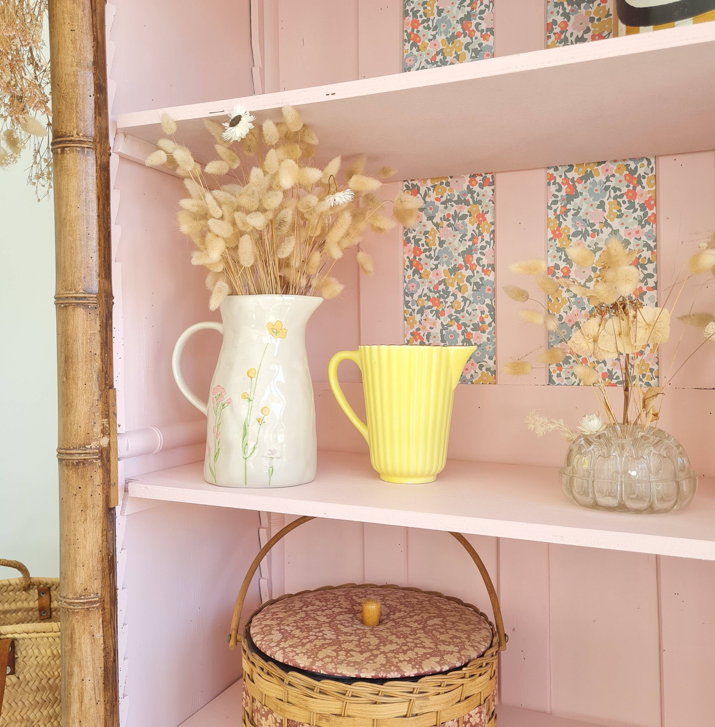 Library, old wooden cabinet imitating bamboo painted in pink