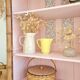 Library, old wooden cabinet imitating bamboo painted in pink