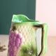 Barbotine pitcher from the 20s/30s with vine and grape decoration, Saint-Clément earthenware factory