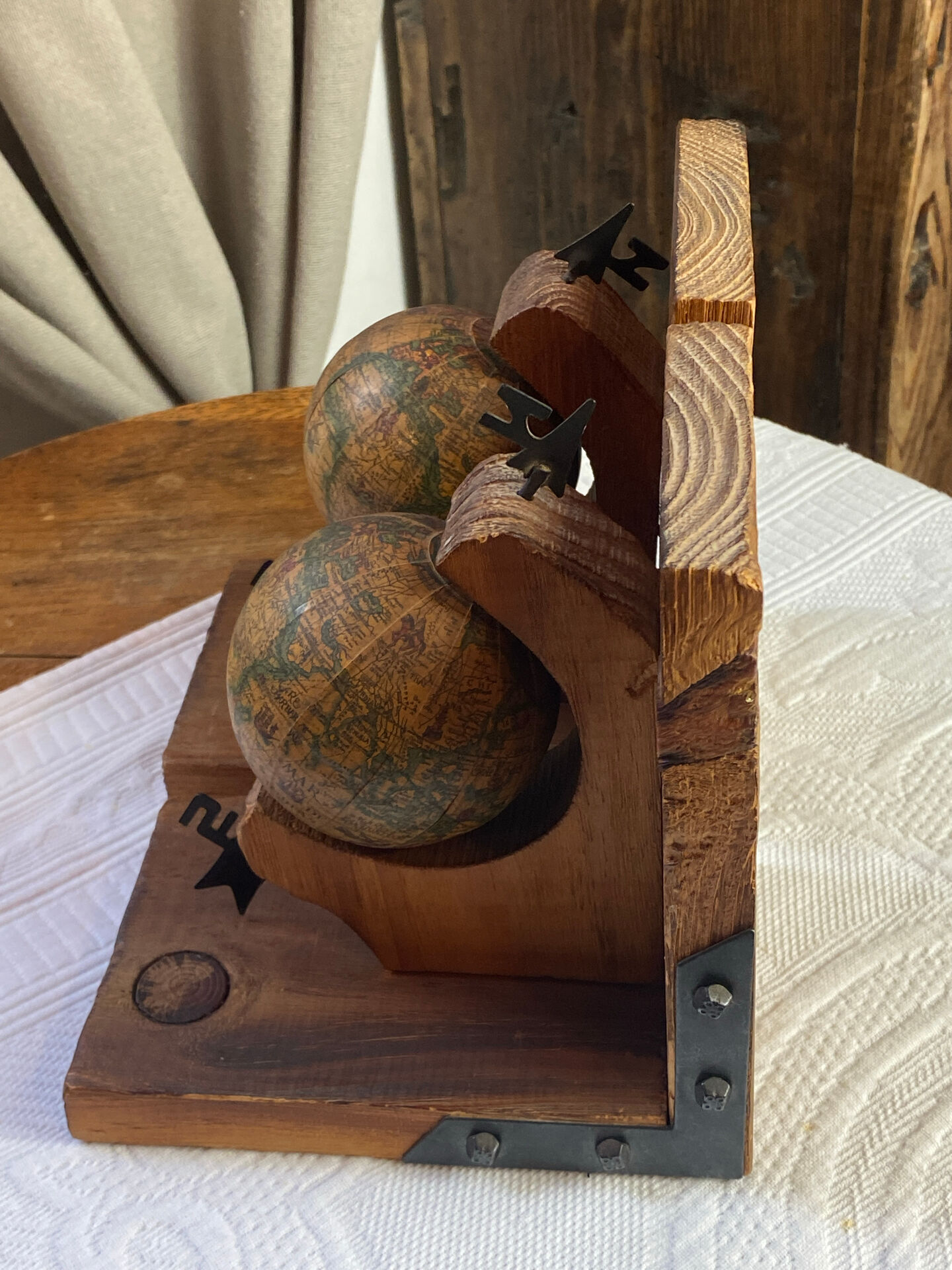 Pair of wooden bookends, rotating globes