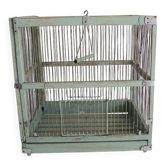 Old wooden and metal birdcage in aqua green.