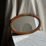Small oval Art Deco mirror in brown and gold 33x54.
