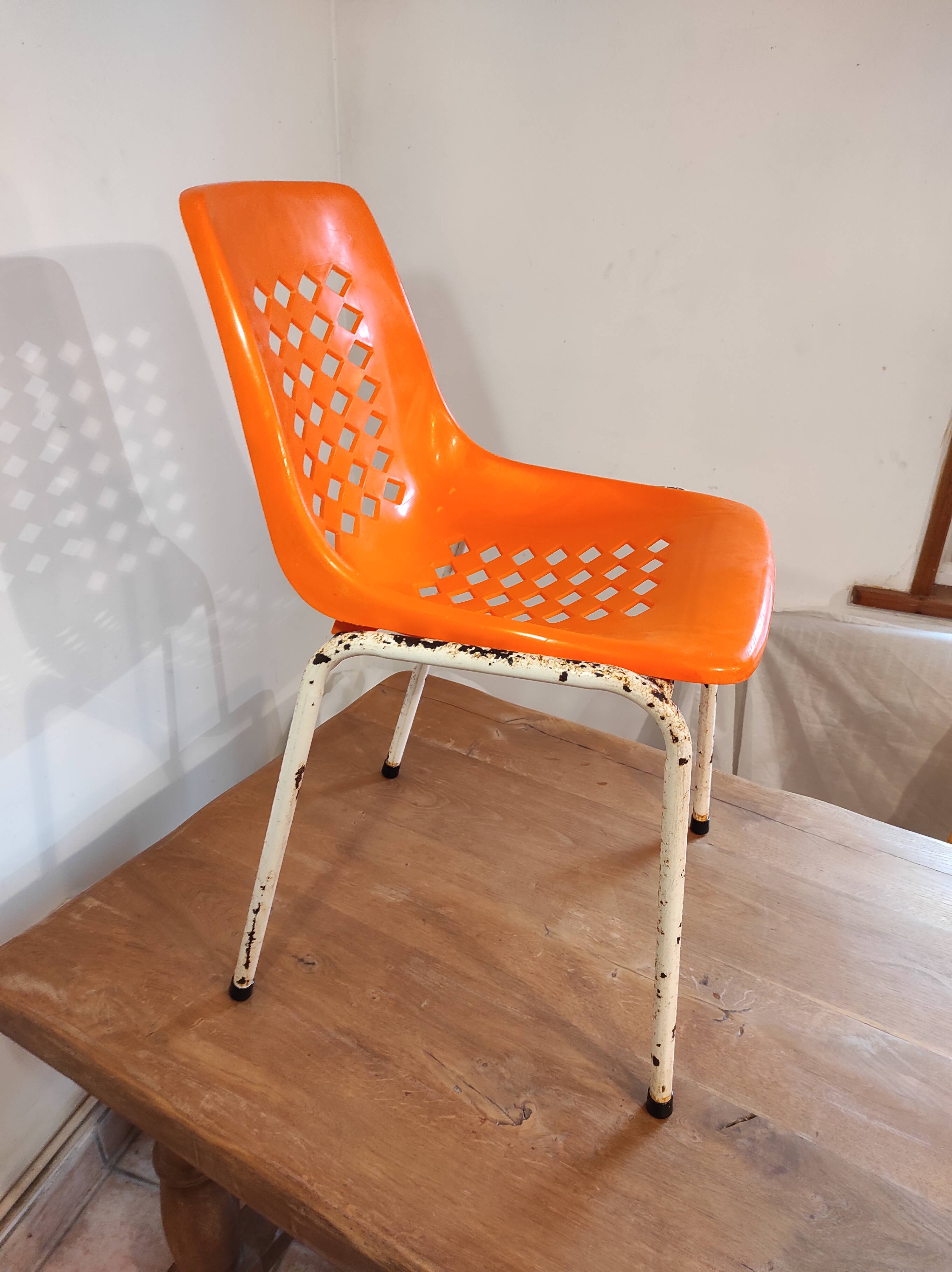 Chair with openwork plastic shell 1970