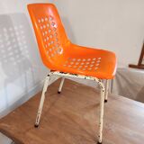 Chair with openwork plastic shell 1970