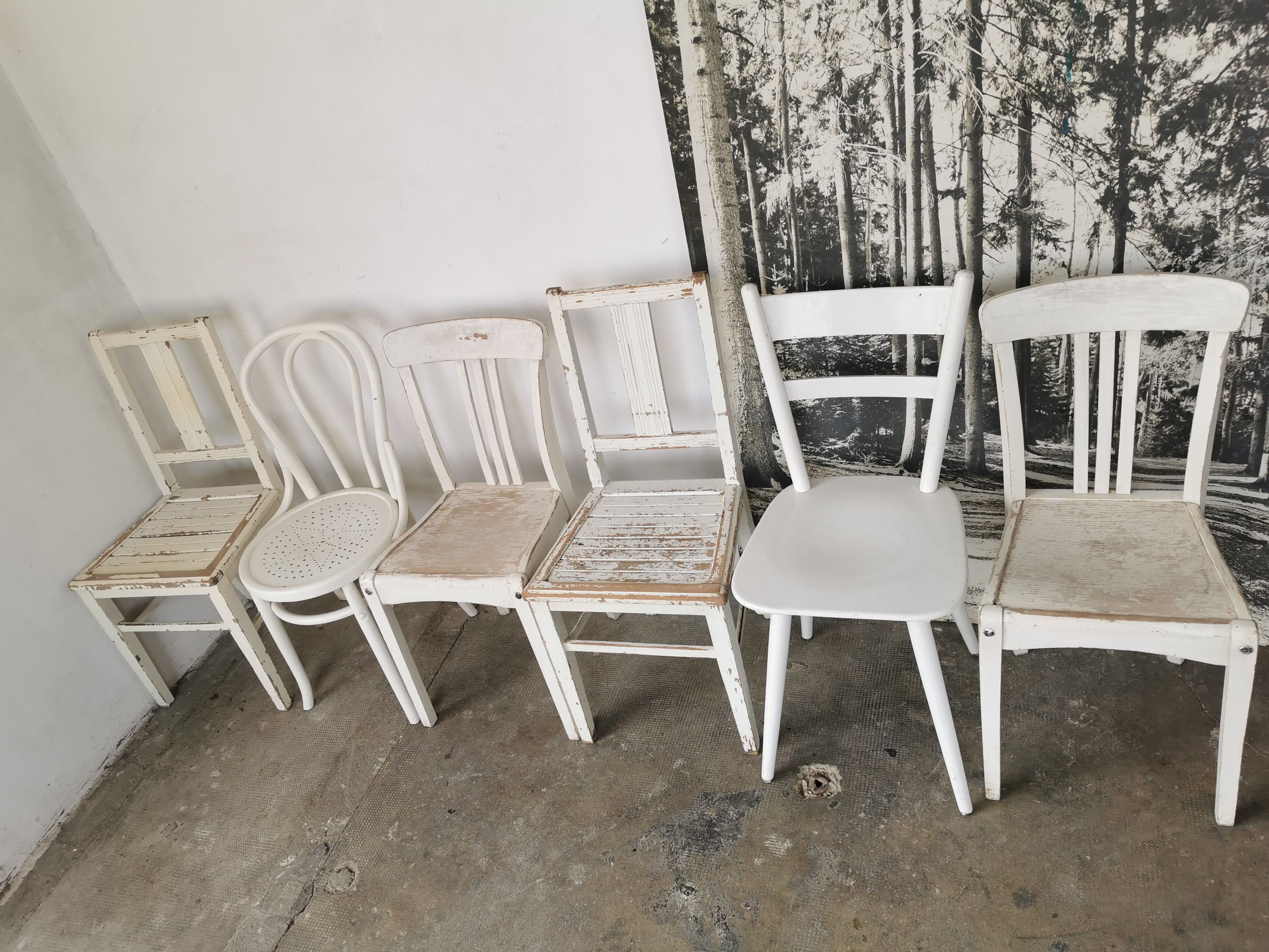 Set of 6 mismatched white chairs