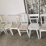 Set of 6 mismatched white chairs