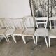 Set of 6 mismatched white chairs