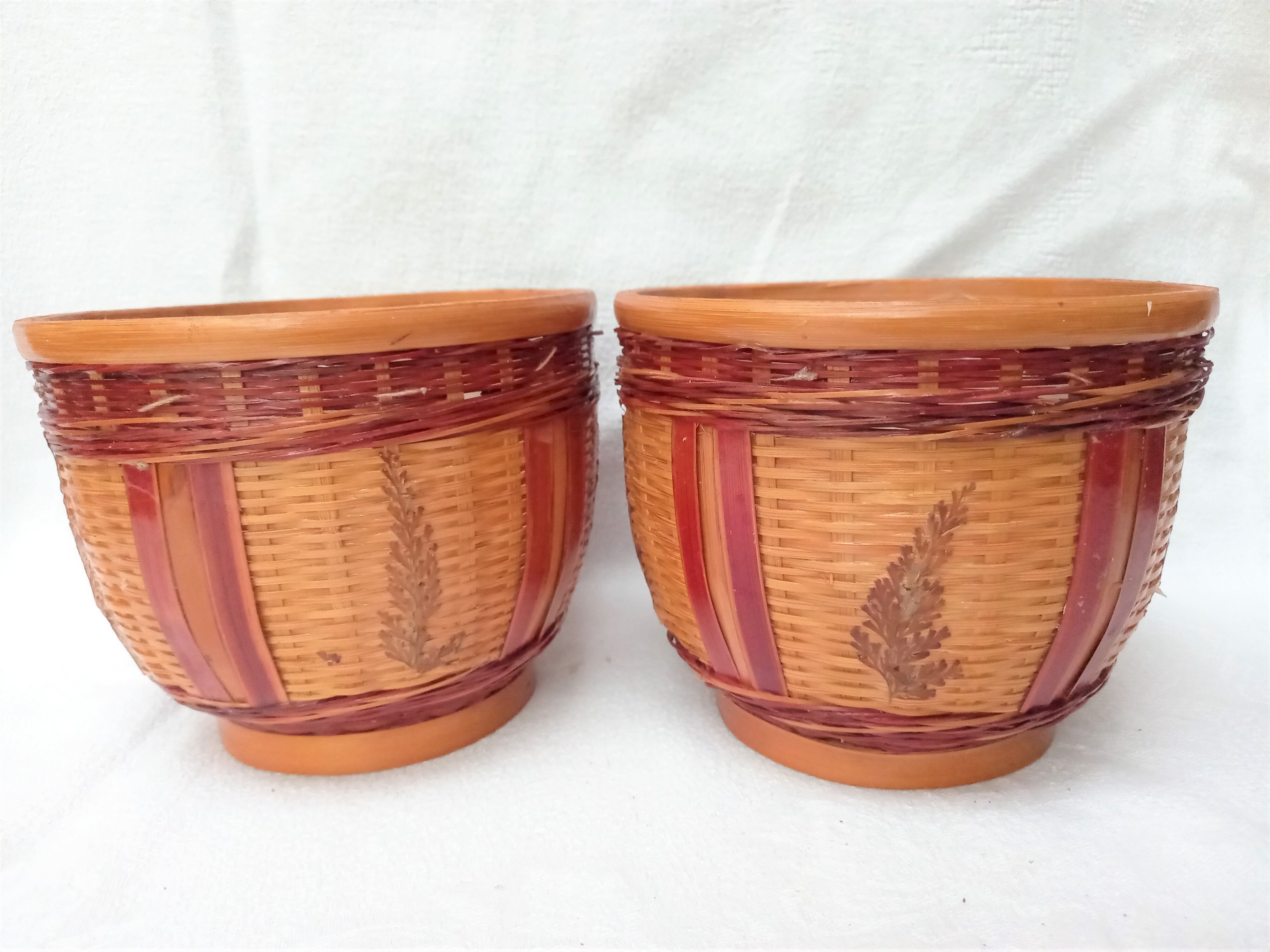 Duo of vintage braided wicker pot cover