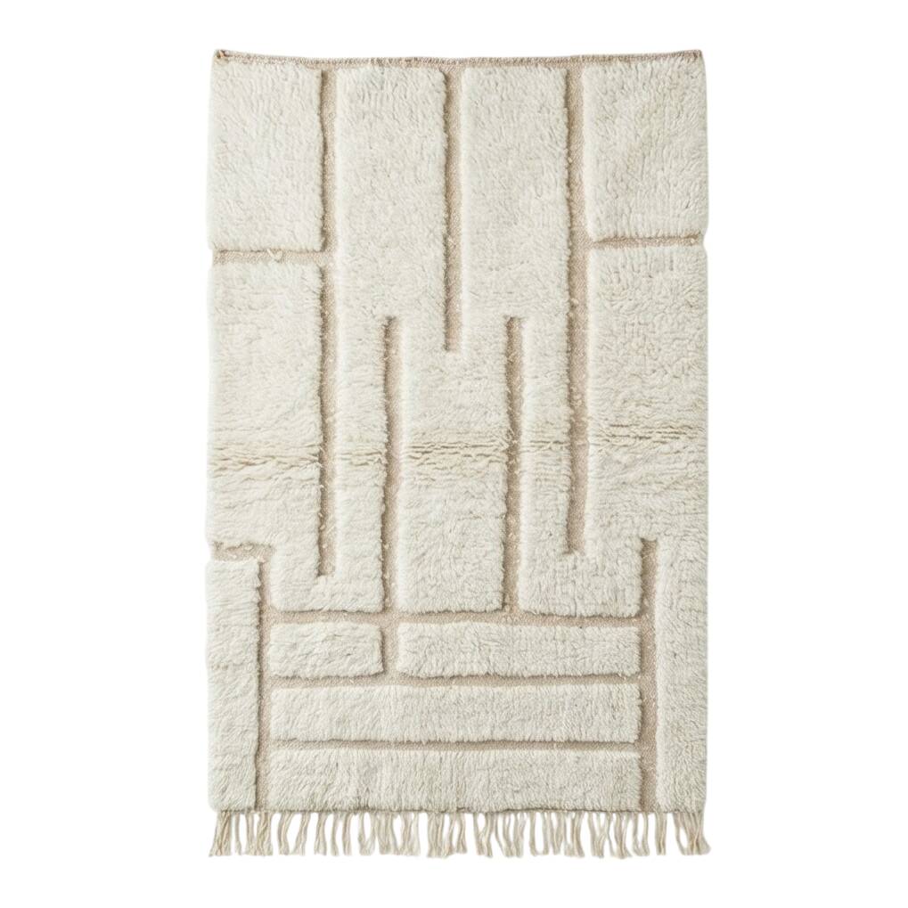 White Moroccan rug with a graphic pattern.