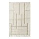 White Moroccan rug with a graphic pattern.