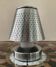 Designer lamp in perforated stainless steel