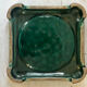 Art Deco bottle coaster in speckled green glazed ceramic and
