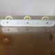 Wall coat rack with 3 coat hooks in bakelite from the 50s and 60s