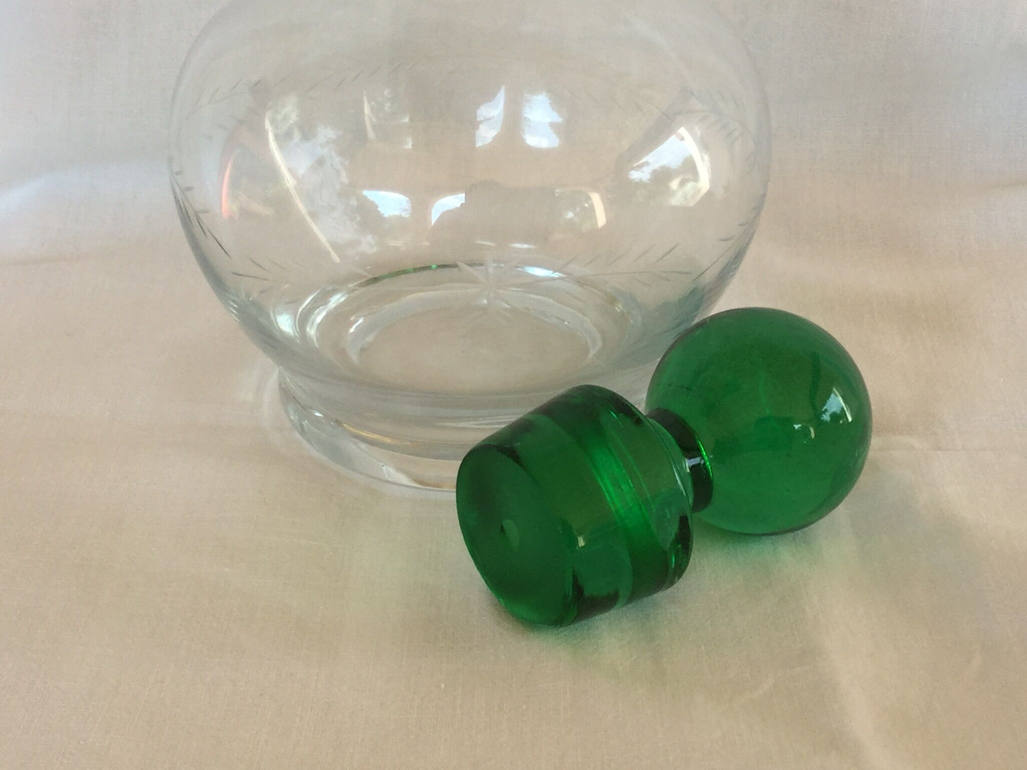 Glass wine carafe with green glass cap