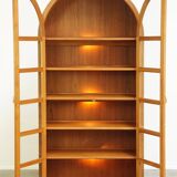 Elegant vintage Danish display cabinet with glass panels and atmospheric lighting