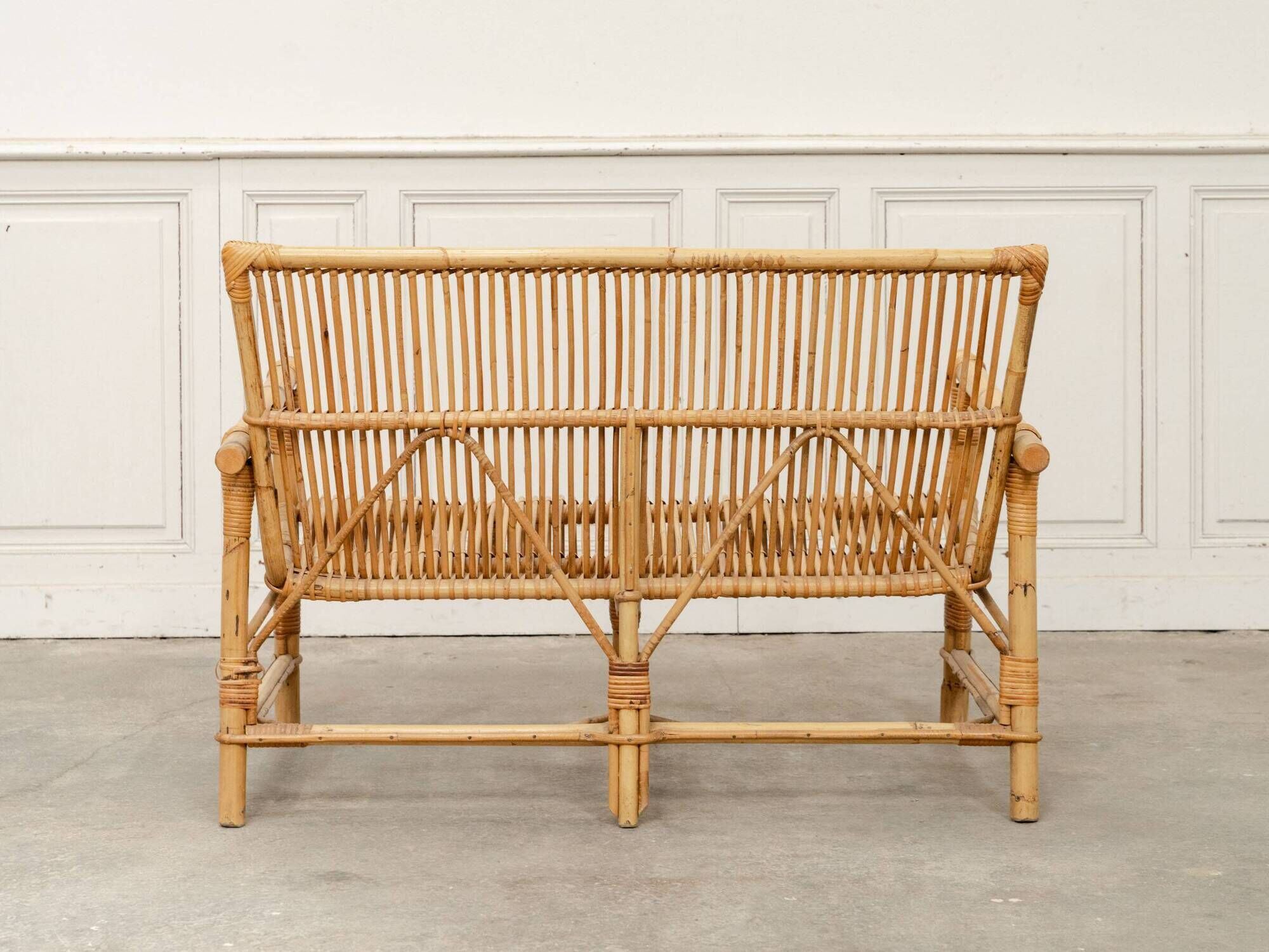Vintage bamboo and rattan bench from the 1970s.