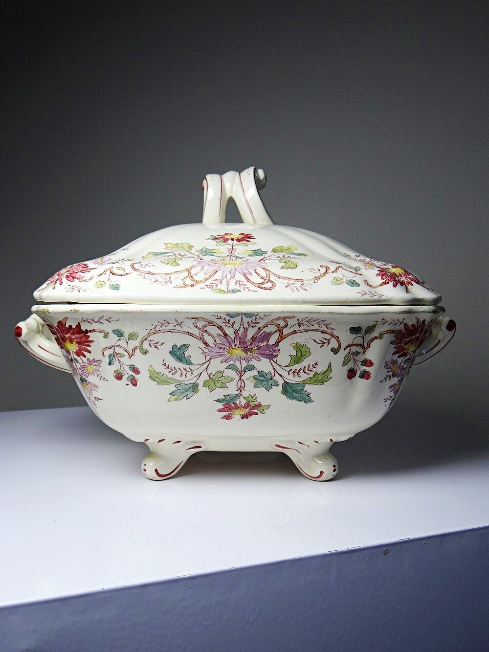 Antique Longchamp soup tureen/vegetable dish with polychrome daisies in ironstone.