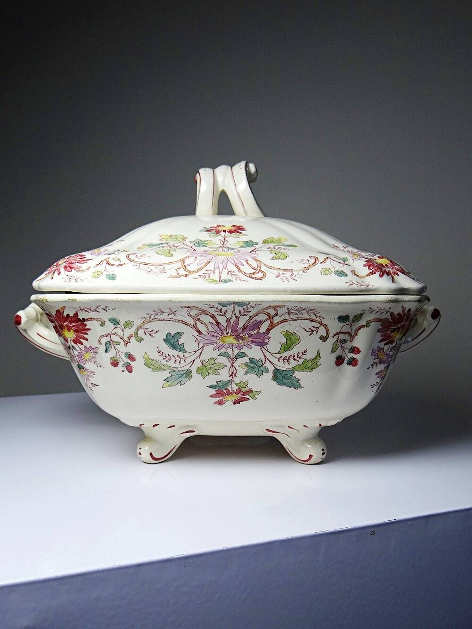 Antique Longchamp soup tureen/vegetable dish with polychrome daisies in ironstone.