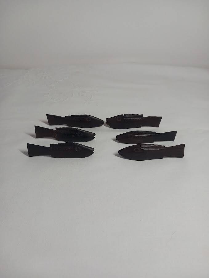 Antique wooden knife rests.