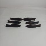 Antique wooden knife rests.