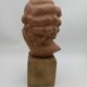 Bust young smiling girl. Circa 1900. Art Deco. Signed.