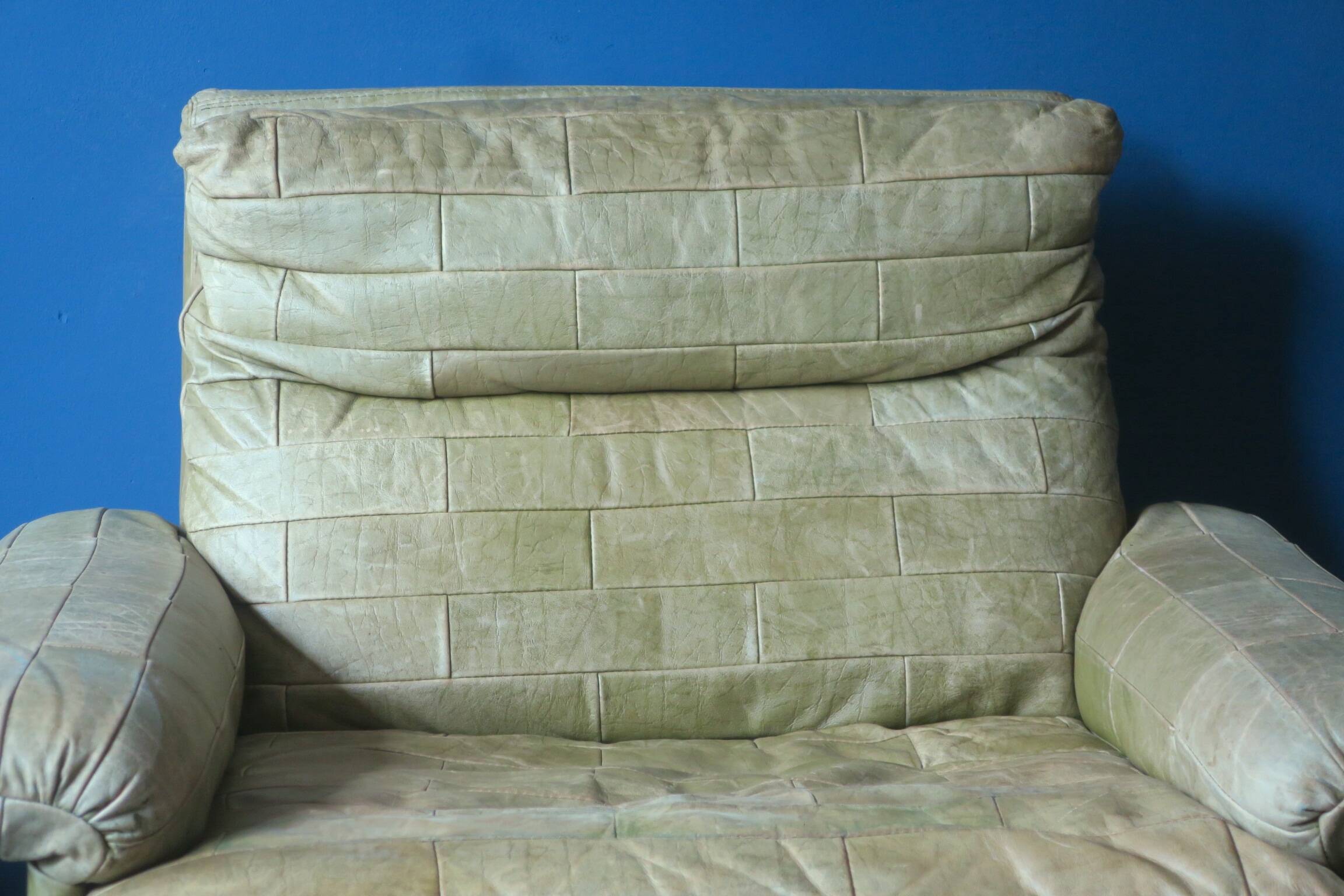 Patchwork leather olive green lounge chair and ottoman by Laauser, 1970s