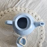 Small vintage sky-blue earthenware teapot