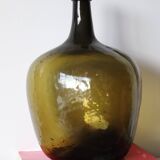 Dame jeanne ancienne en verre martelé