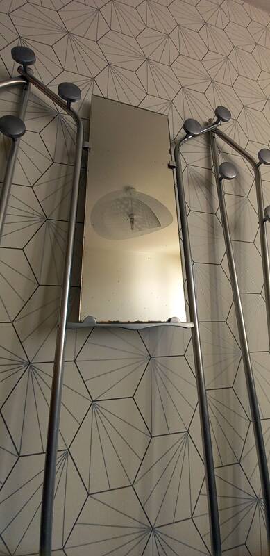 Vintage aluminum wall coat rack.
