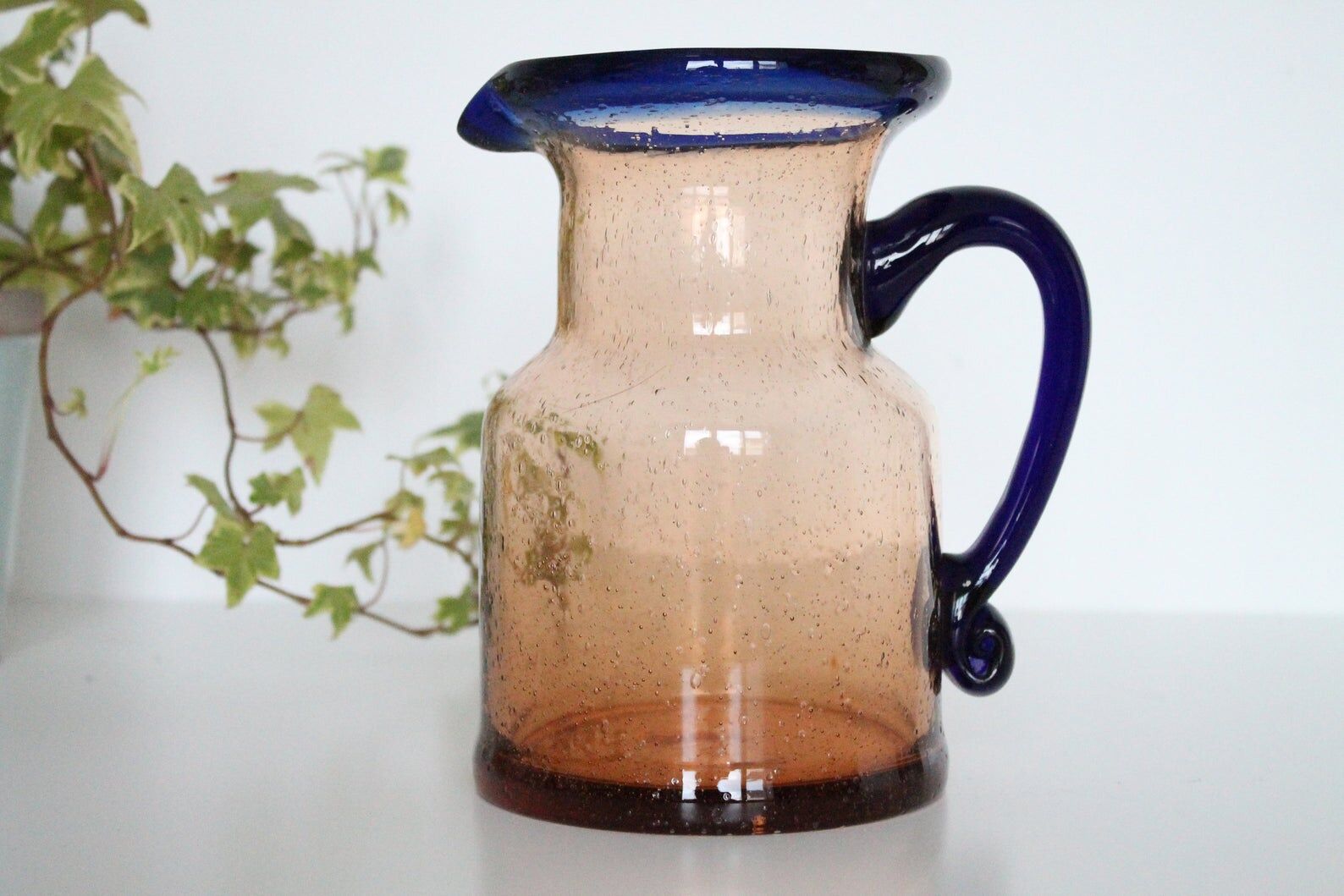 Bubble glass jug made by French craftsmen, blue and orange