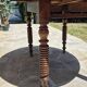 Round dining table with a drop-leaf top in solid walnut, late 19th century.