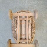 Rattan cradle for doll on vintage wheels