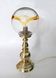 Table lamp in solid brass with a vintage 1970s glass globe.