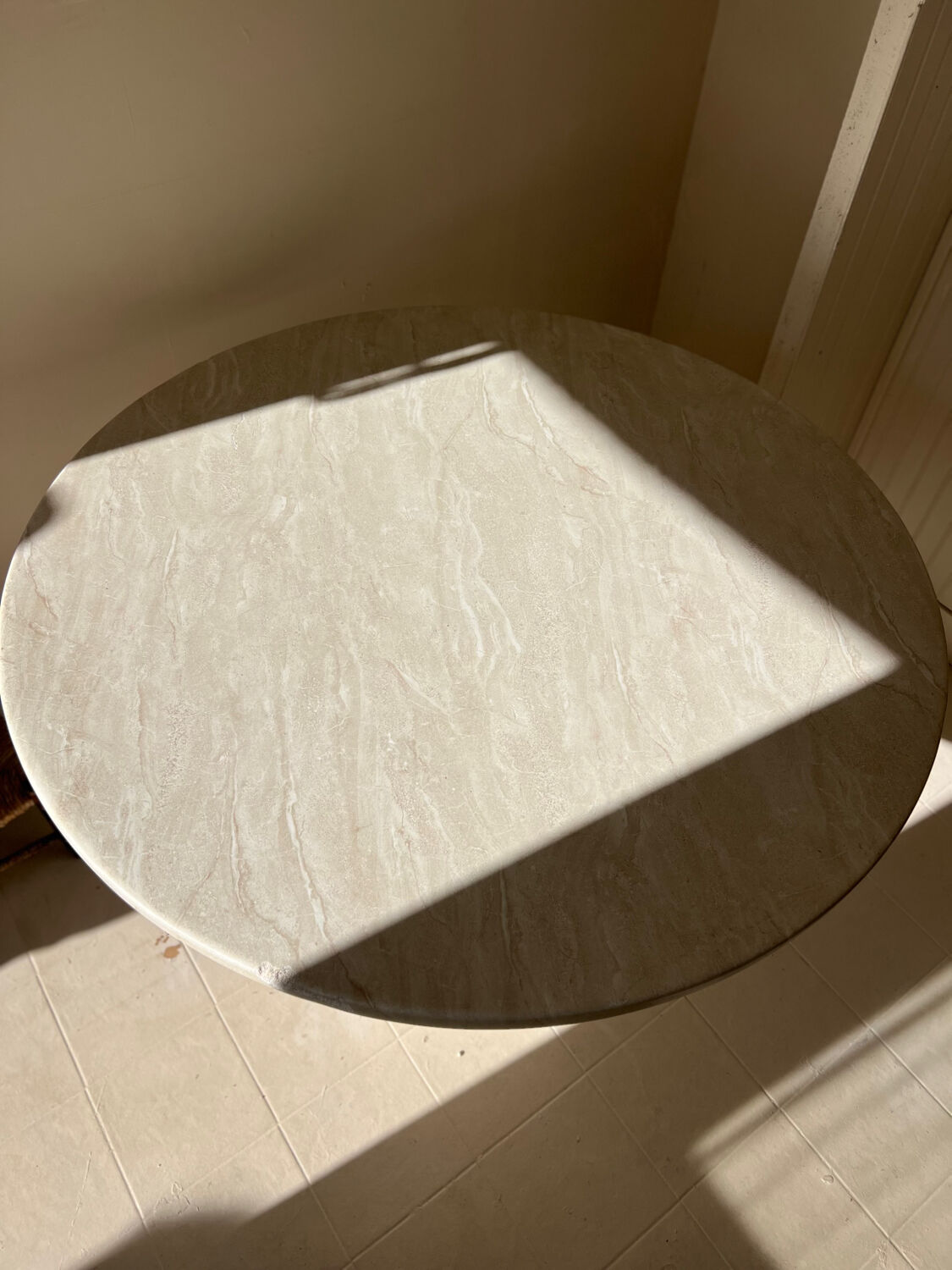 Travertine-effect stone dining table