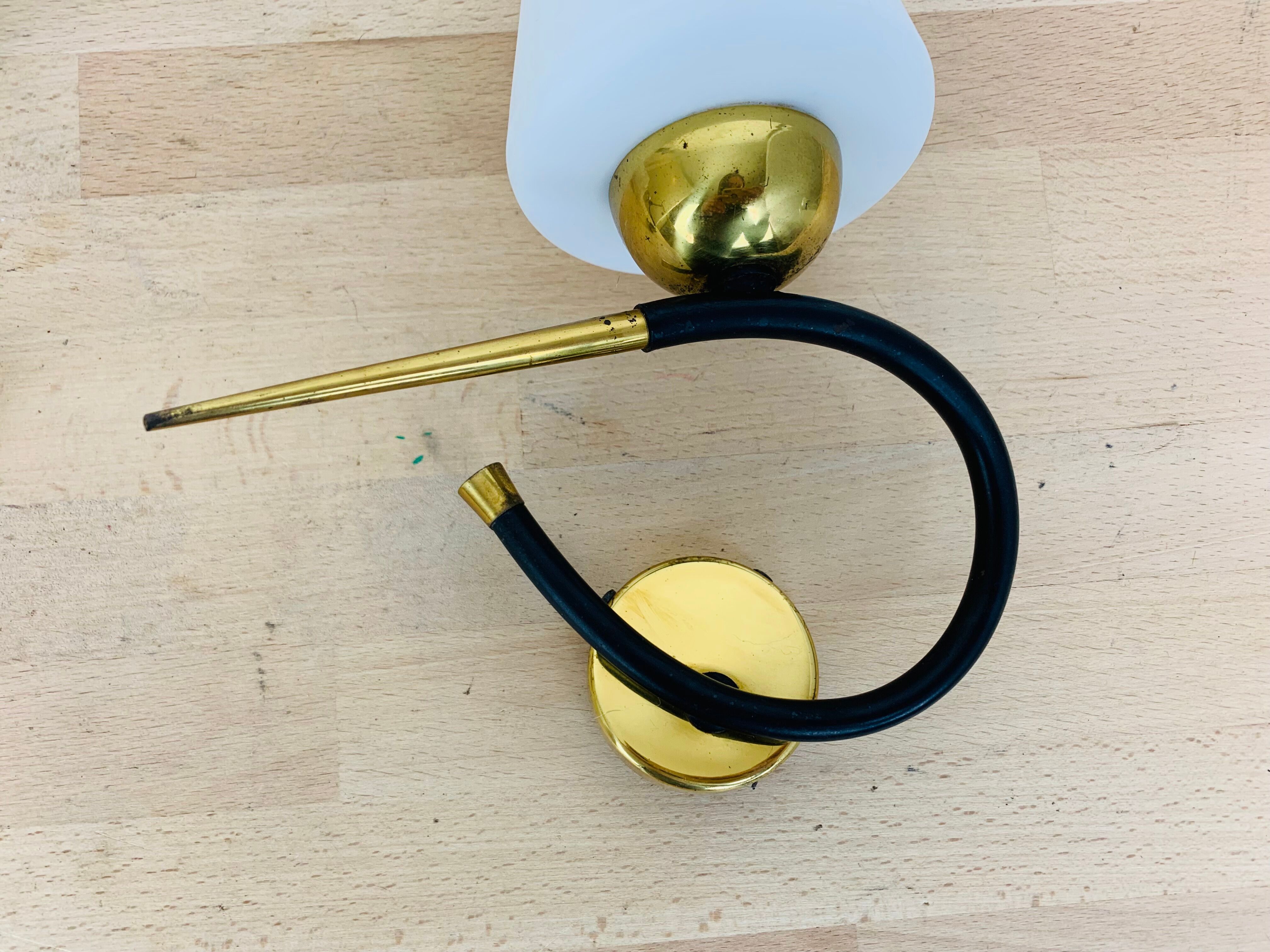 Pair of Arlus 50s opaline black and golden brass wall lamps