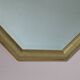 Golden octagonal mirror with bevelled glass from the 1970s.