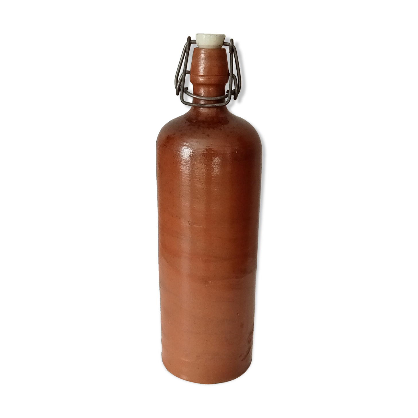 Old bottle in glazed sandstone