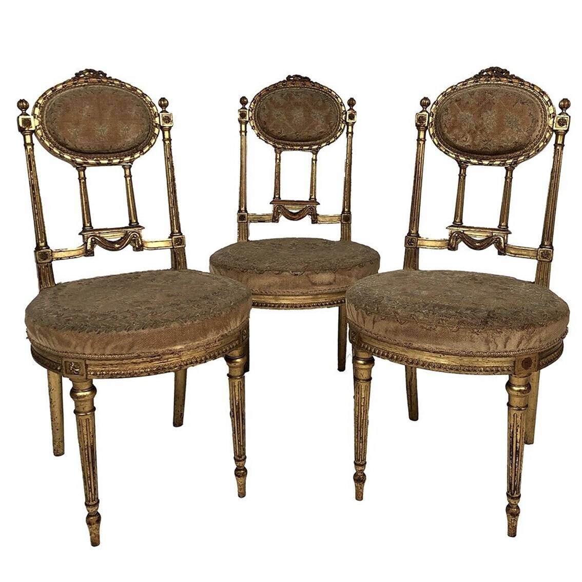 Series of three Louis XVI style chairs in gilded wood, circa 1900