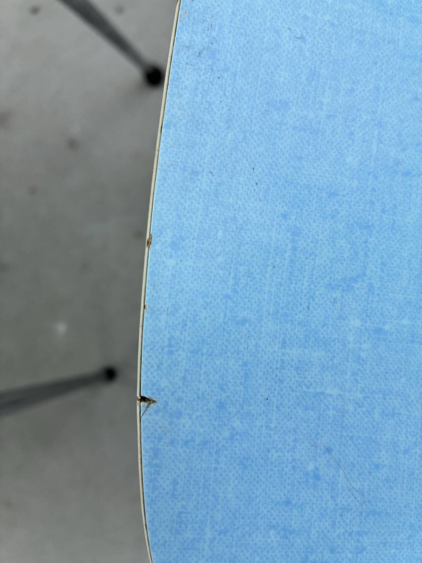 Two blue Formica "Peugeot" chairs.