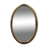 Golden oval mirror