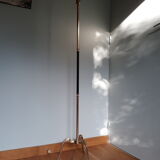 Golden and black tripod floor lamp