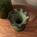 Ancient Greek style ceramic vase with curls