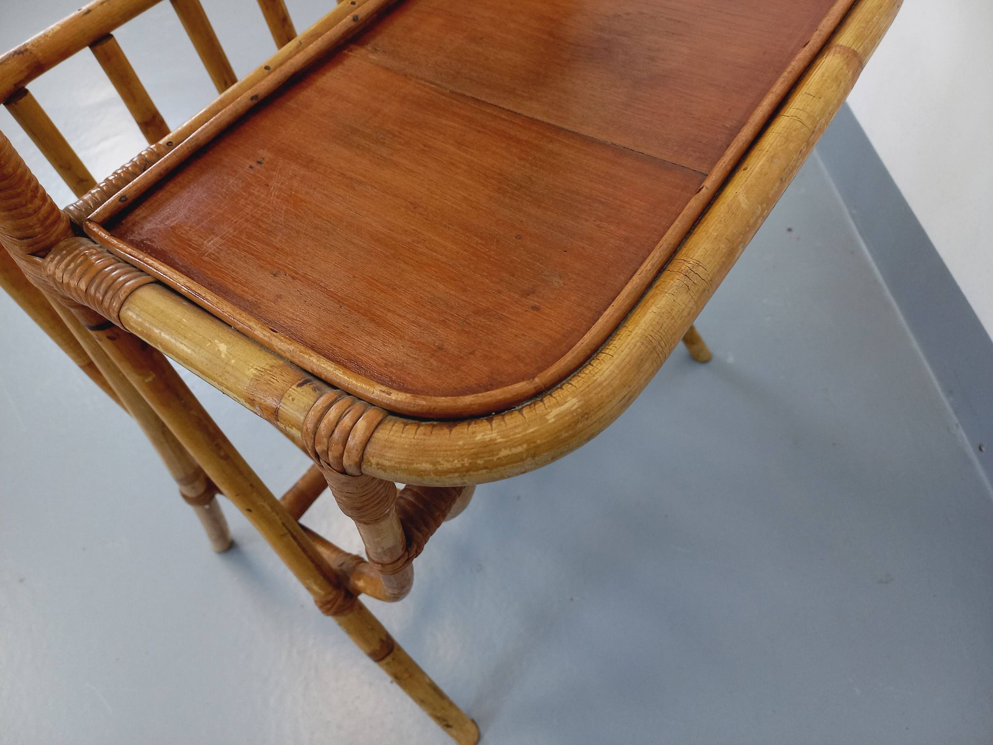 Side table with vintage rattan and wood magazine rack from the 60s
