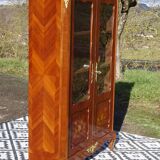 Glass library with rosewood marquetry in the Louis XV style.