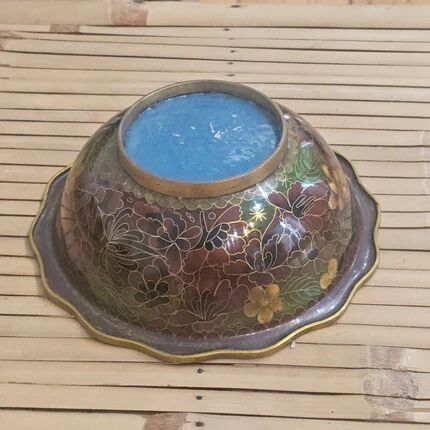 Vintage Asian brass bowl with floral decoration.