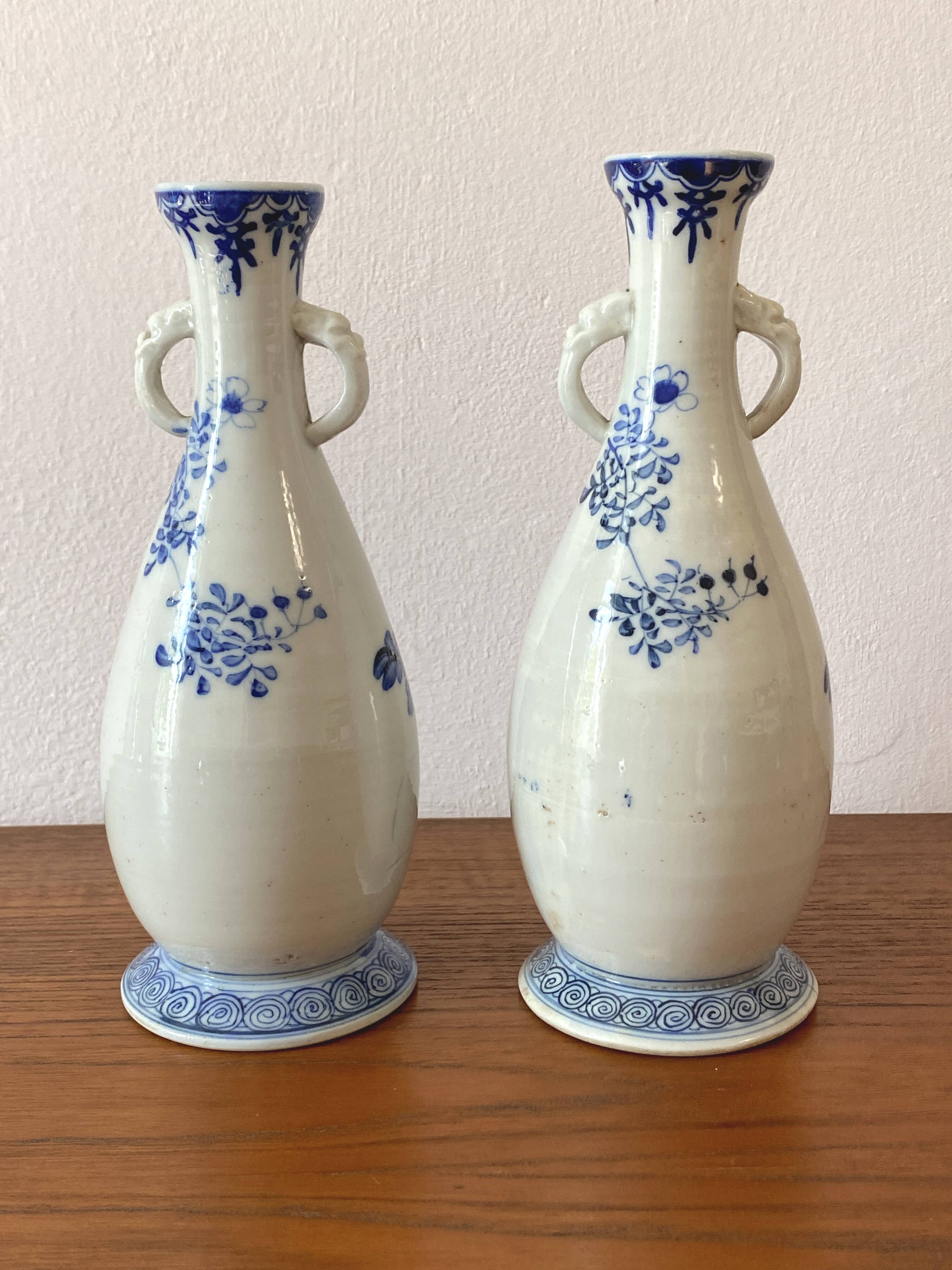 Old pair of blue and white porcelain vases from Japan - in good condition.