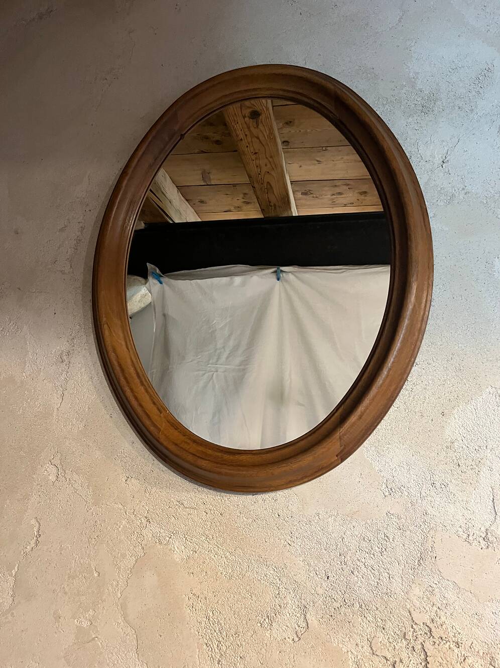 Antique oval walnut mirror